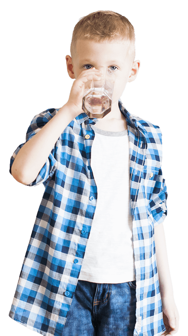 Young boy drinking glass of water